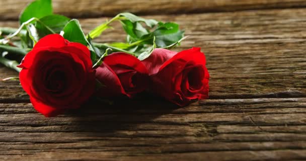 Three Red Roses Wooden Surface Valentines Day Concept — Stock Video