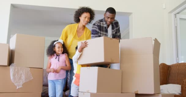 Front View Black Family Unpacking Cardboard Boxes Comfortable Home Black — Stock Video