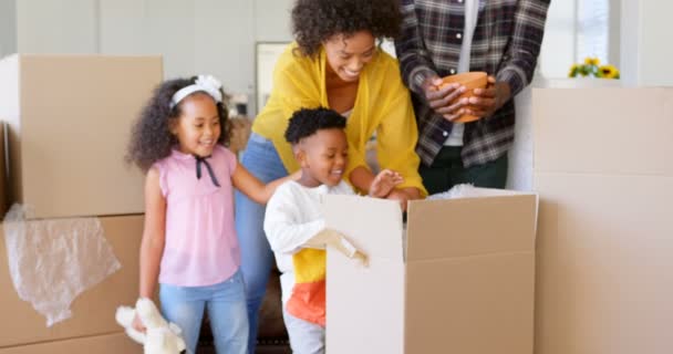 Front View Black Family Unpacking Cardboard Boxes Comfortable Home Black — Stock Video