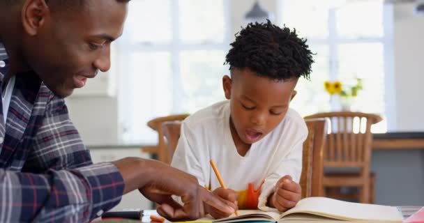 Side View Black Father Helping His Son Homework Comfortable Home — Stock Video