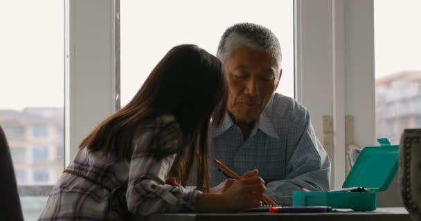 Old Senior Asian Grandfather Helping His Granddaughter Homework Comfortable Home — Stock Video