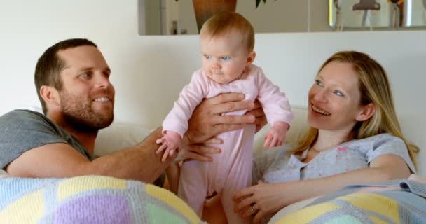 Front View Mid Adult Caucasian Parents Playing Holding Baby Bed — Stock Video