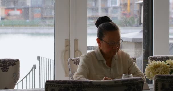 Front View Old Senior Asian Woman Sitting Dining Table Comfortable — Stock Video