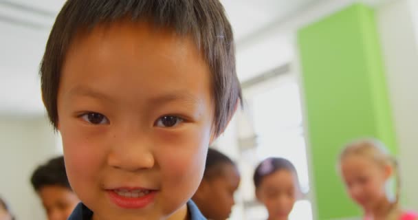 Portrait Happy Cute Asian Schoolboy Standing Classroom School Looking Camera — Stock Video