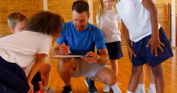 Front View Caucasian Male Sport Teacher Group Diverse Schoolkids Discussing — Stock Video