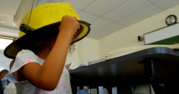 Side View African American Schoolgirl Wearing Firefighter Helmet Classroom School — Stock Video