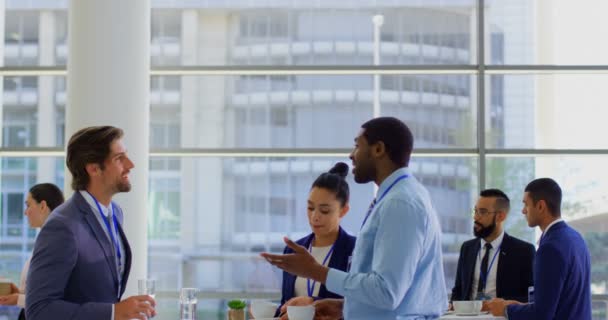 Multi Ethnic Business People Interacting Each Other While Holding Coffee — Stock Video