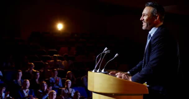 Side View Mature Caucasian Businessman Speaking Business Seminar Stage Auditorium — Stock Video