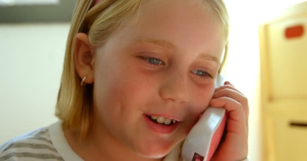 Close Caucasian Schoolgirl Pretending Executive School She Talking Toy Phone — Stock Video