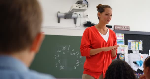 Front View Caucasian Female Teacher Teaching Schoolkids Classroom Schoolkids Raising — Stock Video