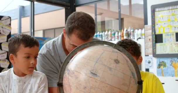 Front View Young Caucasian Male Teacher Teaching Kids Geography Globe — Stock Video