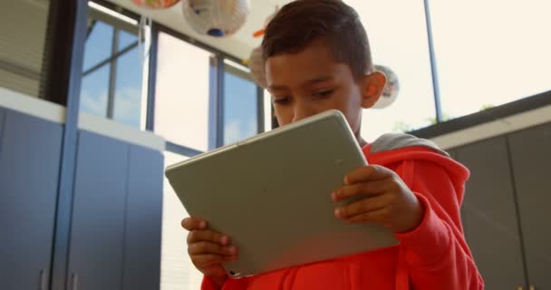 Low Angle View Attentive Asian Schoolboy Studying Digital Tablet Classroom — Stock Video