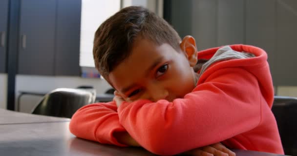 Front View Asian Schoolboy Leaning Desk Classroom School Looking Camera — Stock Video