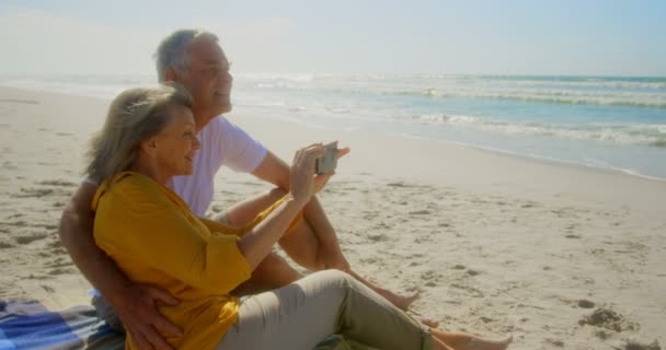 Side View Active Senior Caucasian Couple Clicking Photos Beach Relaxing — Stock Video