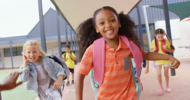 Front View Mixed Race Schoolkids Schoolbags Running Corridor School Smiling — Stock Video