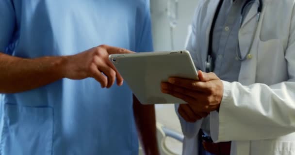 Mid Section Multi Ethnic Medical Team Discussing Report Digital Tablet — Stock Video