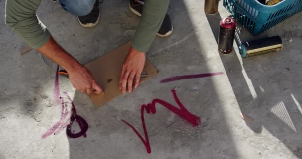 High Angle View Caucasian Graffiti Artist Cutting Cardboard Cutter Floor — Stock Video