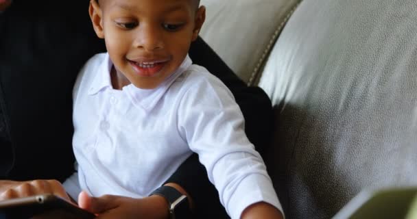 Front View Smiling African American Mother Son Using Laptop Sofa — Stockvideo