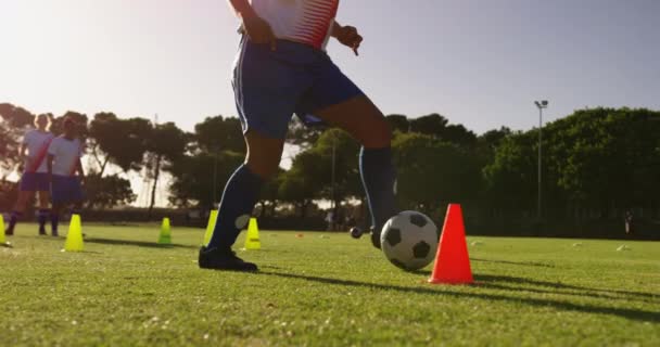 Front View Diverse Female Soccer Player Training Slalom Soccer Field — Stock Video