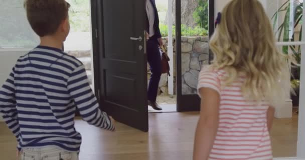 Front View Caucasian Father Embracing His Two Children Enters House — Stock Video