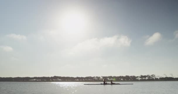 Side View Two Young Adult Caucasian Women Rowing Racing Shell — Stock Video