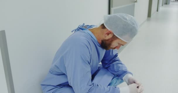 Side View Worried Caucasian Male Doctor Walking Corridor Depressed — Stock Video