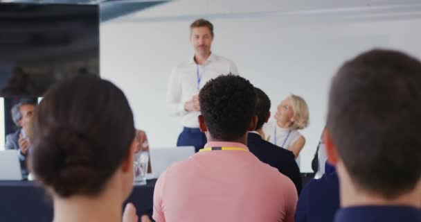 Front View Young Caucasian Businessman Standing Address Audience Flanked Seated — Stock Video