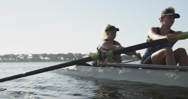 Front View Two Young Adult Caucasian Women Rowing Racing Shell — Stock Video