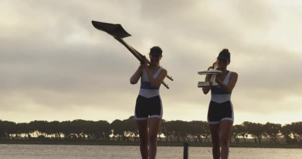 Front View Two Young Adult Caucasian Female Rowers Taliking Carrying — Stock Video