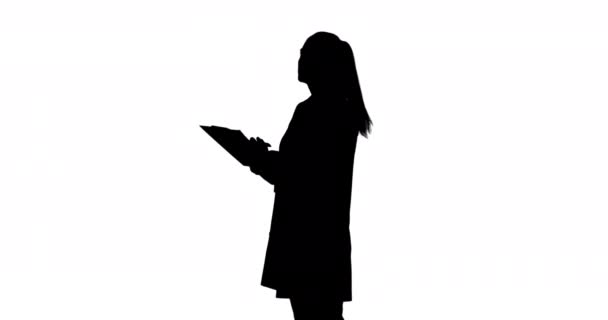 Side View Young Woman Nodding Writing Holding Clipboard Black Silhouette — Stock Video