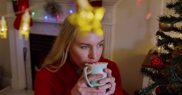 Front View Young Caucasian Woman Decratiosn Hanging Foreground Holding Cup — Stock Video