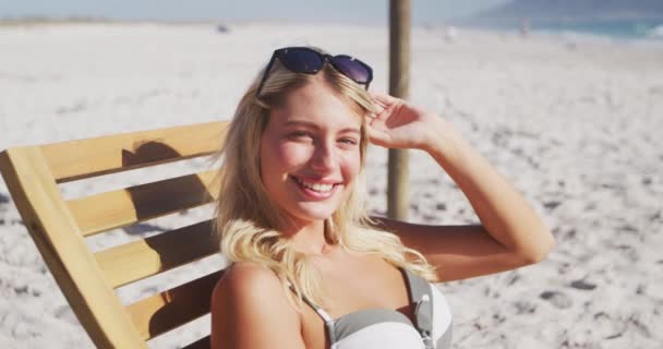 Portrait Caucasian Woman Enjoying Time Beach Sitting Sunbed Looking Camera — Stock Video