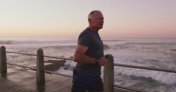 Senior Fit Caucasian Man Working Out Promenade Sea Wearing Sports — Stock Video