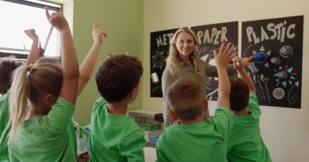 Multi Ethnic Group Children Caucasian Female Teacher Pointing Posters Discussing — Stock Video