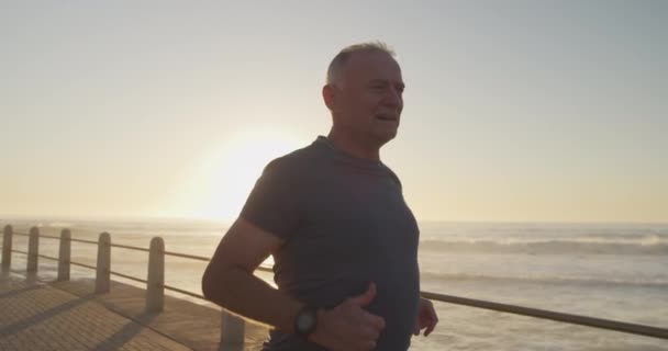 Senior Fit Caucasian Man Working Out Promenade Sea Wearing Sports — Stock Video