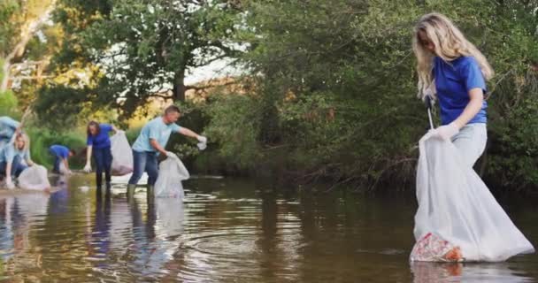 Multi Ethnic Group Happy Conservation Volunteers Cleaning River Sunny Day — Stock Video