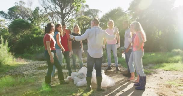 Multi Ethnic Group Happy Conservation Volunteers Cleaning River Countryside Cheering — Stock Video