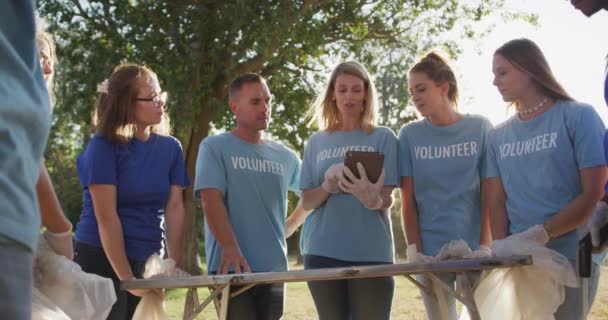 Multi Ethnic Group Conservation Volunteers Cleaning River Sunny Day Countryside — Stock Video