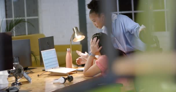 Young African American Woman Assists Biracial Woman Business Office Setting — Stock Video