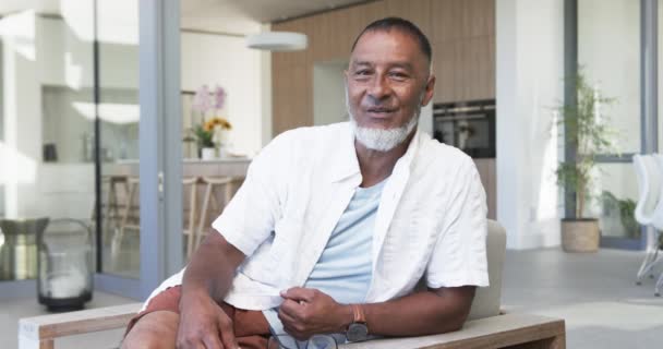 Biracial Man His Fifties Greying Hair Sits Casually Dressed Appears — Stock Video