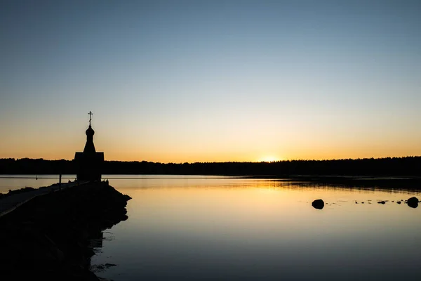 A small chapel in the background of the sunset. — Stock Photo, Image