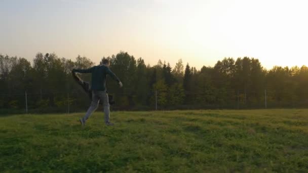Man Runs Field Throwing His Backpack Jacket Liberation Worries Return — Stock Video