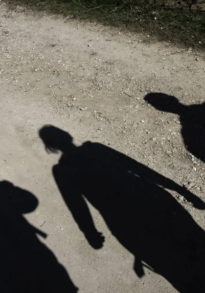 Shadows of people walking through the mountains, sport and adventure