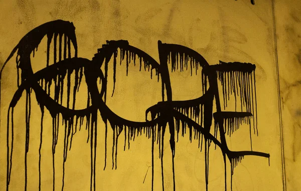 Gore letters painted on urban wall, symbol and fear