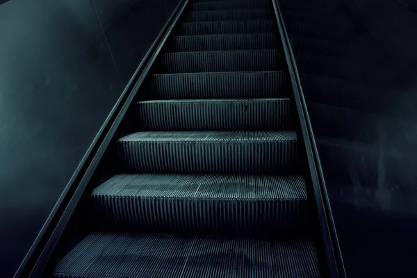 Escalators in interior of building, textures and architecture