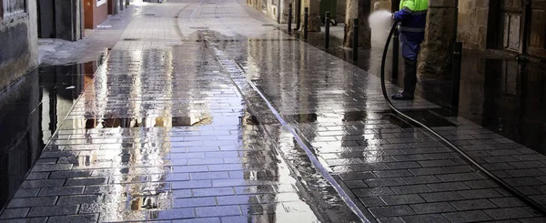 Sweeper cleaning street