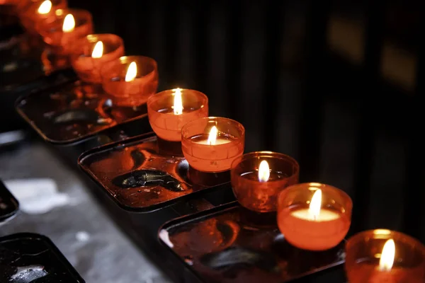 Candles lit lourdes — Stock Photo, Image