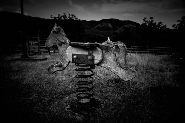 Wooden horse abandoned playground, games and fun, childhood