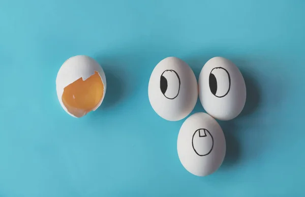 White eggs with painted faces