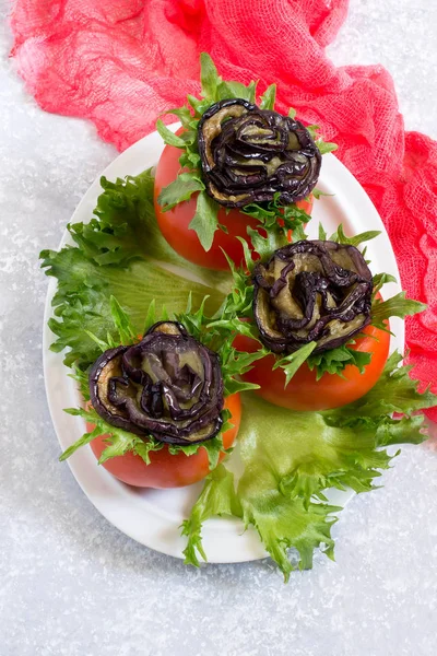 Tomatoes stuffed with cheese with eggplants in form of rose. Original festive snack. Healthy and dietary food